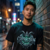 Male model with arm tattoos leaning against a brick alley wall at night wearing a premium black graphic streetwear t-shirt featuring a detailed chiseled Capricorn crown and horn design by Essentia Collective.