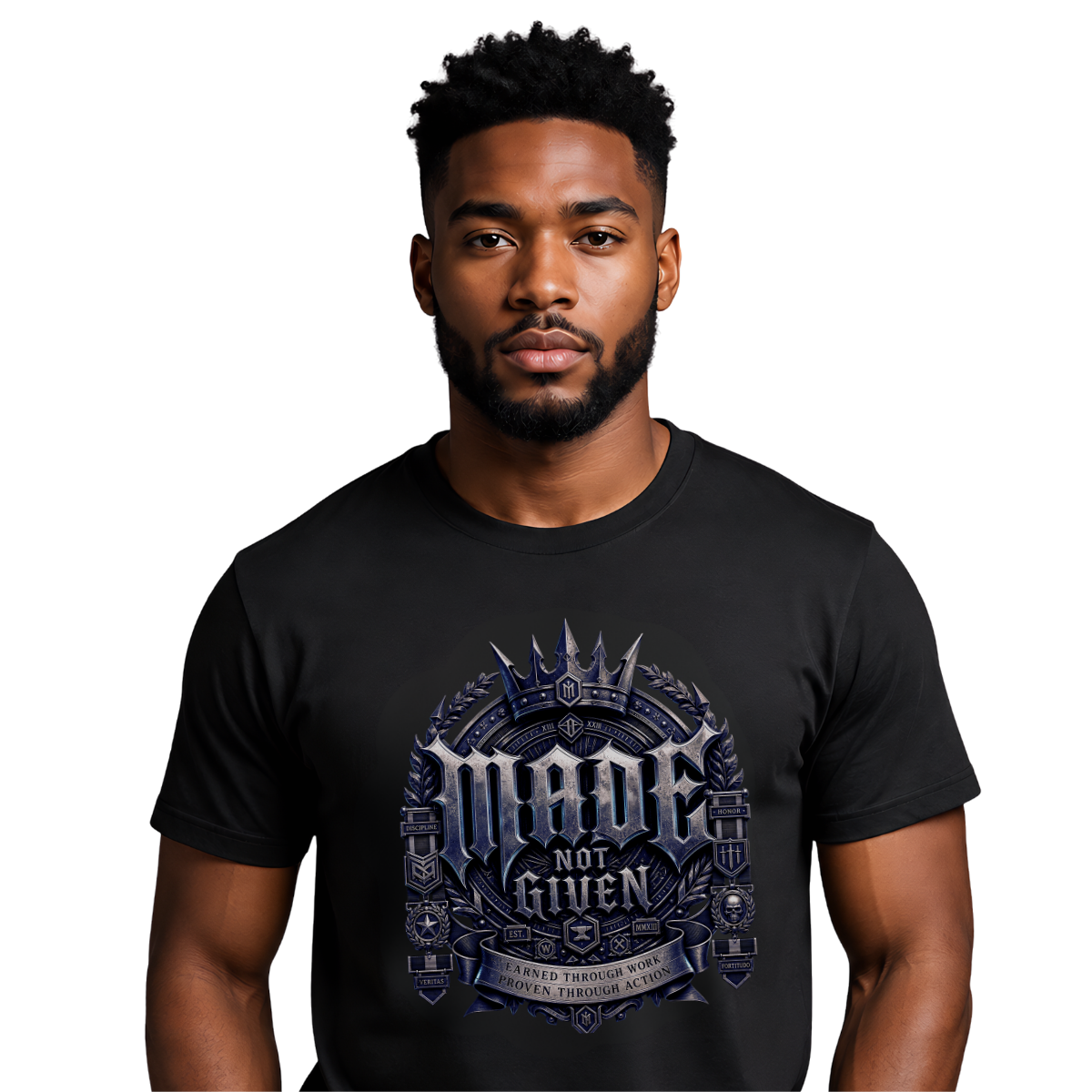 male model with a sharp beard on a clean white background, wearing a premium heavyweight black streetwear t-shirt with a detailed silver and blue metallic gothic chest graphic reading Made Not Given.