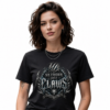 female model with short wavy brown hair on a clean white background, wearing a black Essentia Collective graphic tee featuring a detailed silver and blue metallic gothic chest graphic reading No Crown Just Claws.