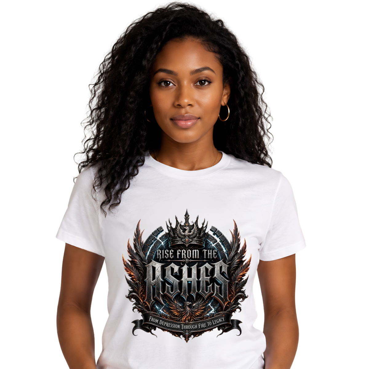 Rise From The Ashes Graphic White T-Shirt Studio portrait mockup of a female model with long curly hair on a clean white background, wearing a white graphic streetwear t-shirt with a prominent black, silver, and amber gothic crest reading Rise From The Ashes.