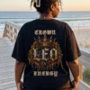 Model wearing Leo Crown Energy black gothic streetwear T-shirt on beach boardwalk