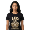 Female model wearing a black Leo zodiac graphic T-shirt featuring gold-toned Zeus-inspired mythology artwork.