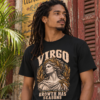 Male model with dreadlocks wearing a black Virgo graphic T-shirt against a rustic red wall.