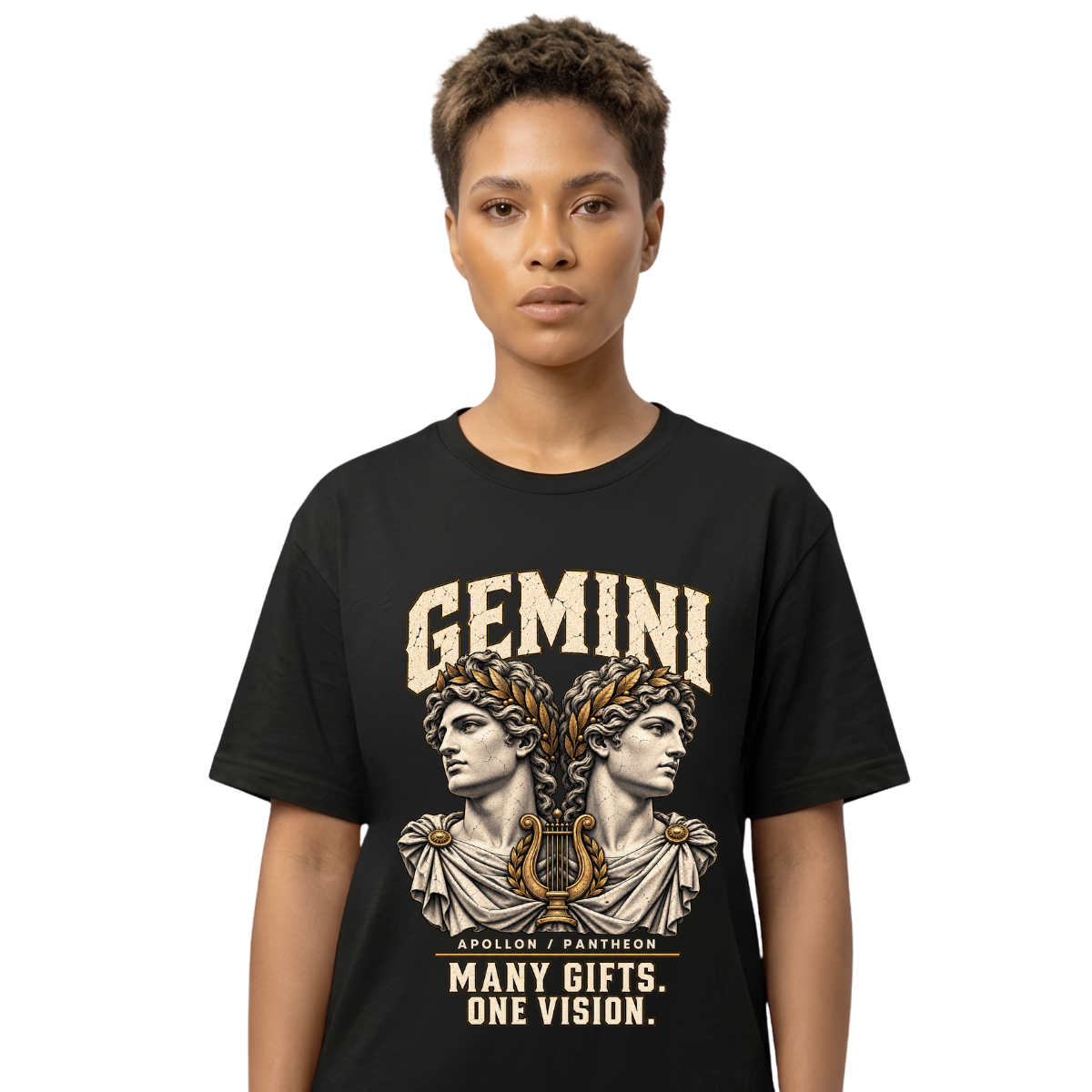 Female model wearing a black Gemini zodiac graphic T-shirt featuring gold-toned Apollon-inspired mythology artwork.